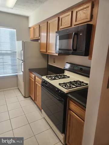 a kitchen with a stove and a microwave