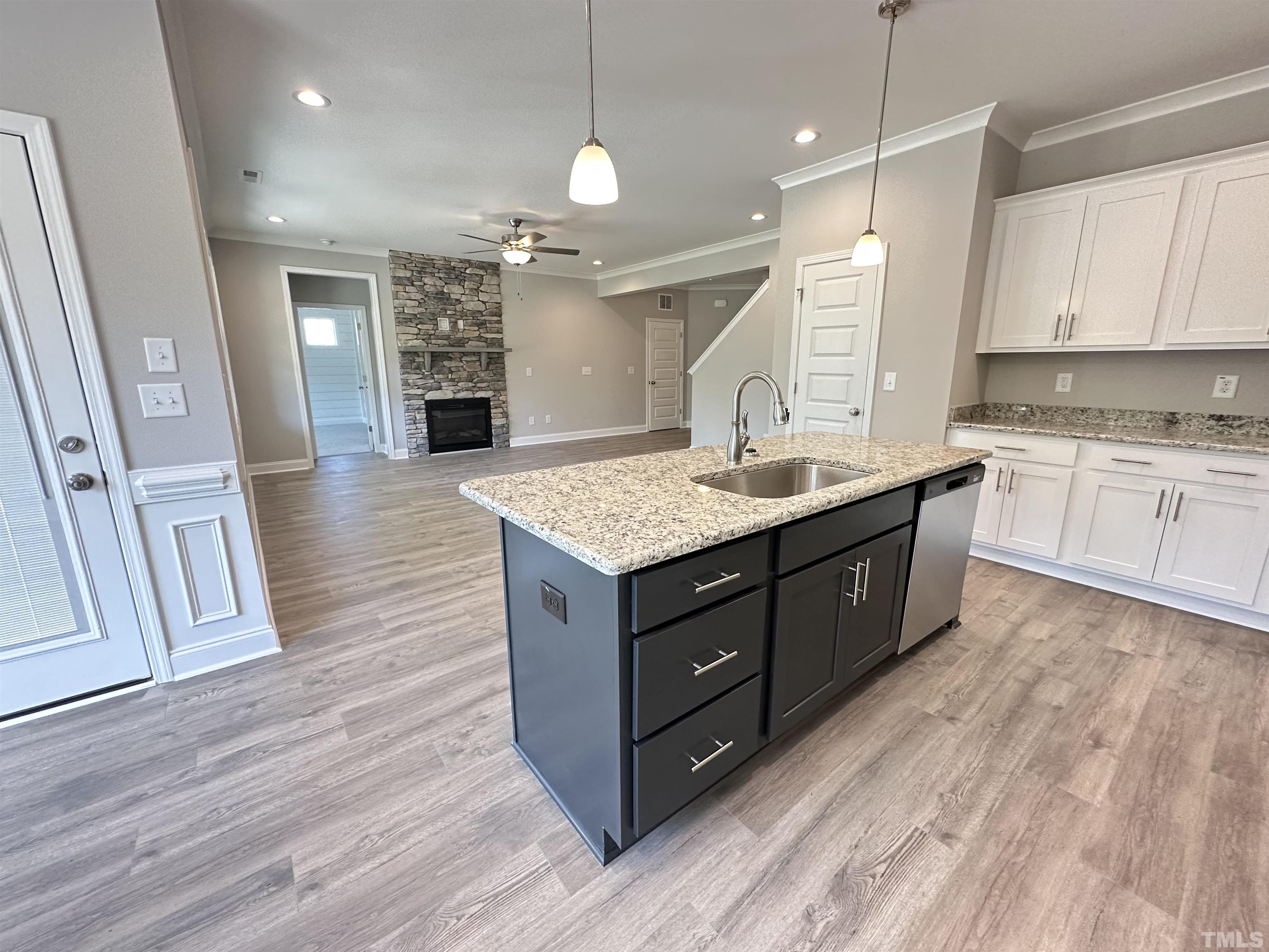 448 Jackson Pond Drive Smithfield, NC 27577 - Photo 4 of 25 a kitchen with a sink and a stove top oven