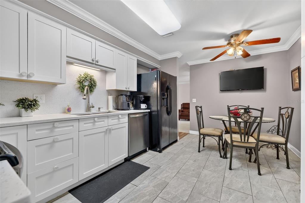 575 Tiberon Cove Road Longwood, FL 32750 - Photo 22 of 56 a kitchen with cabinets a sink and appliances