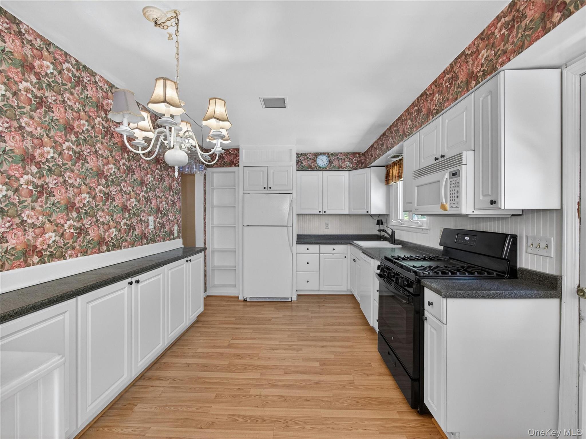 56 Oak Road New City, NY 10956 - Photo 10 of 30 a kitchen with stainless steel appliances granite countertop a white cabinets stove a sink and dishwasher
