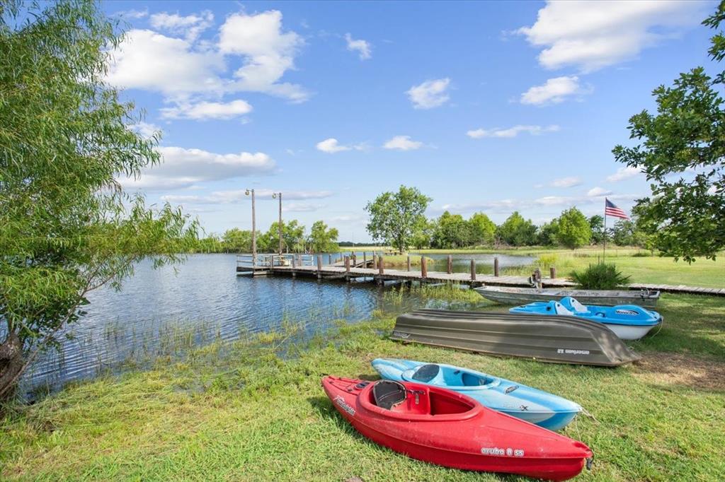 3356 Kattner Road Riesel, TX 76682 - Photo 36 of 40 Dock area featuring a water view and a yard