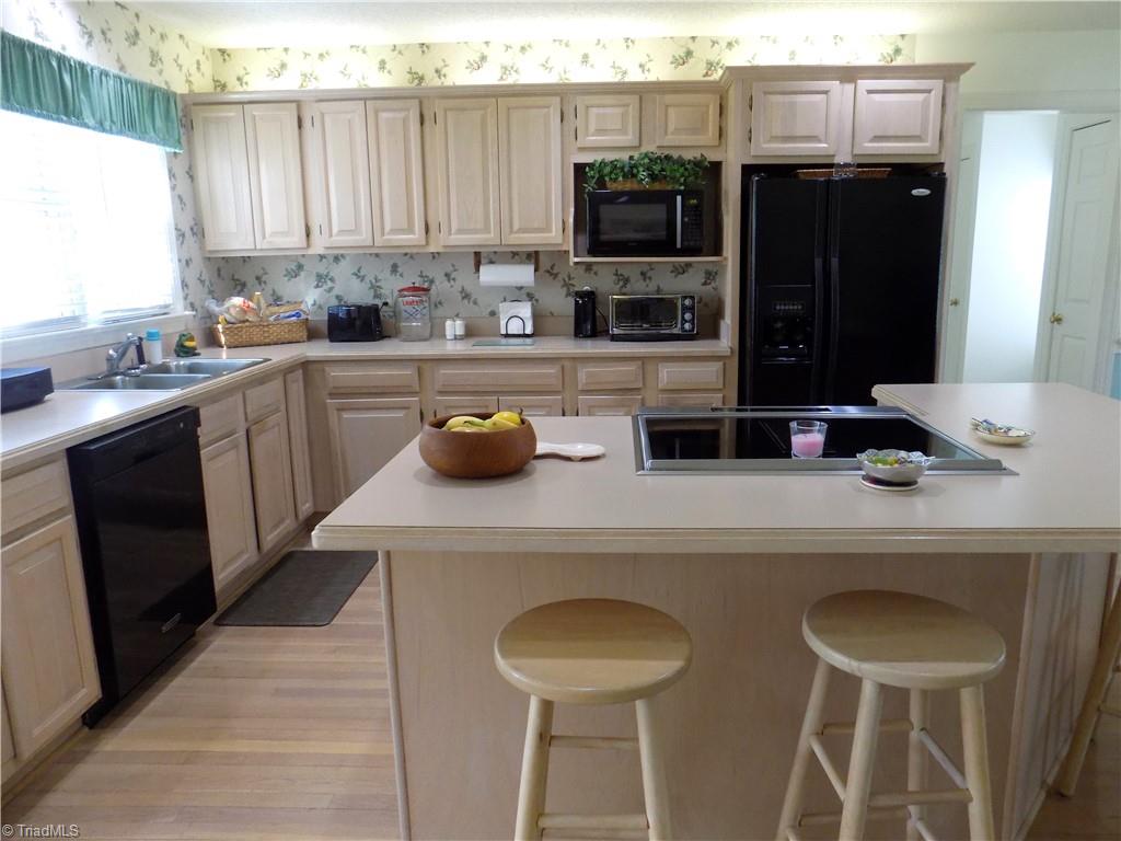 3857 Sandlewood Road High Point, NC 27265 - Photo 42 of 42 Sizeable kitchen w/ open floor plan features island w/ seating, office area & sitting room