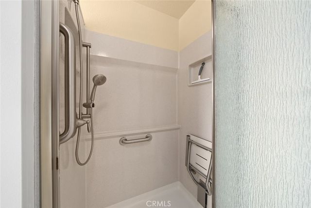 a bathroom with a glass shower door