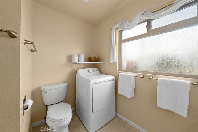 a view of bathroom with a toilet and a shower
