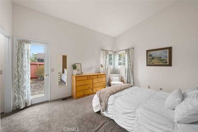 a bedroom with a bed and a furniture