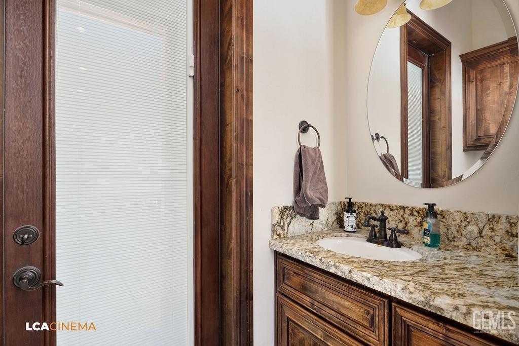 Undisclosed Address Keene, CA 93531 - Photo 16 of 46 a bathroom with a granite countertop sink and a mirror