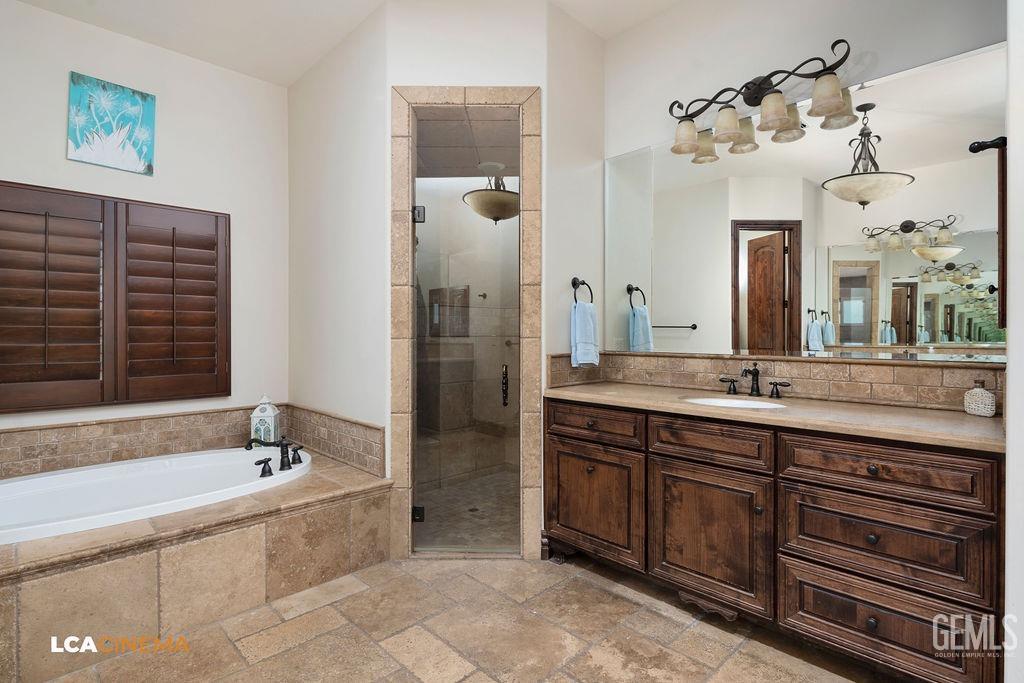 Undisclosed Address Keene, CA 93531 - Photo 23 of 46 a spacious bathroom with a granite countertop sink mirror and a bathtub