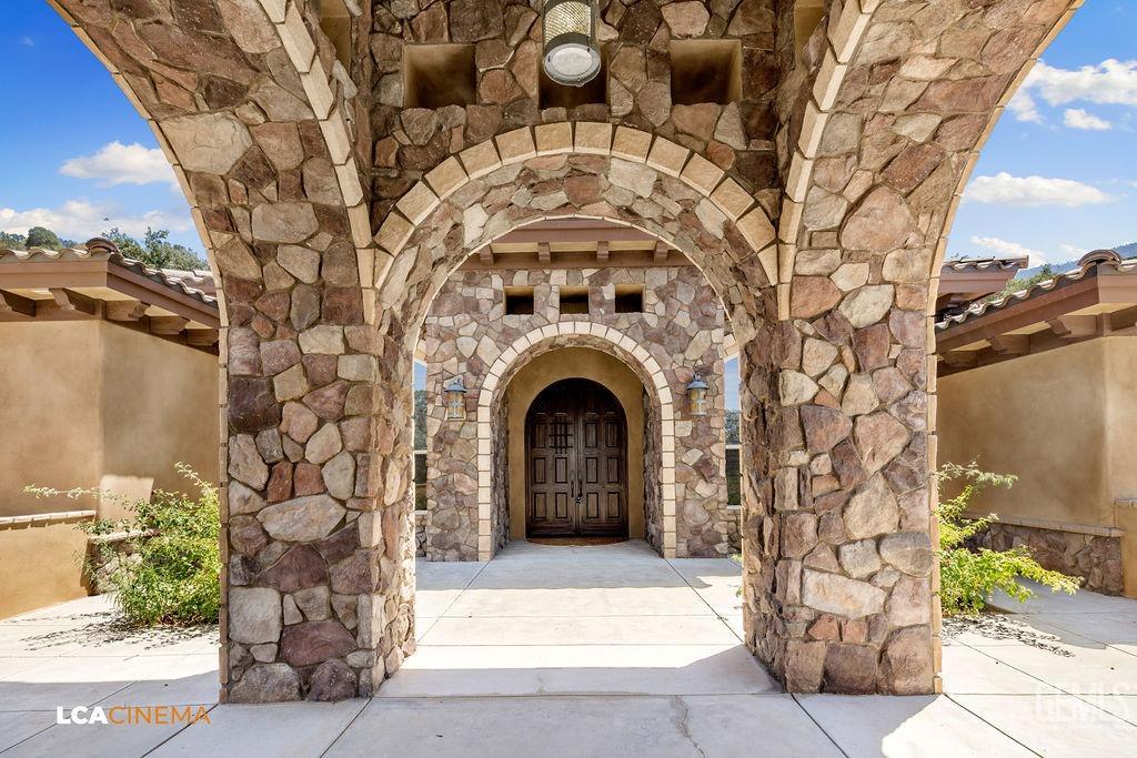 Undisclosed Address Keene, CA 93531 - Photo 3 of 46 a view of a door of the house with a tree