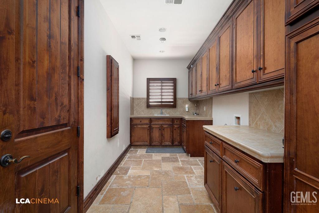 Undisclosed Address Keene, CA 93531 - Photo 32 of 46 a kitchen with stainless steel appliances granite countertop a stove and a refrigerator
