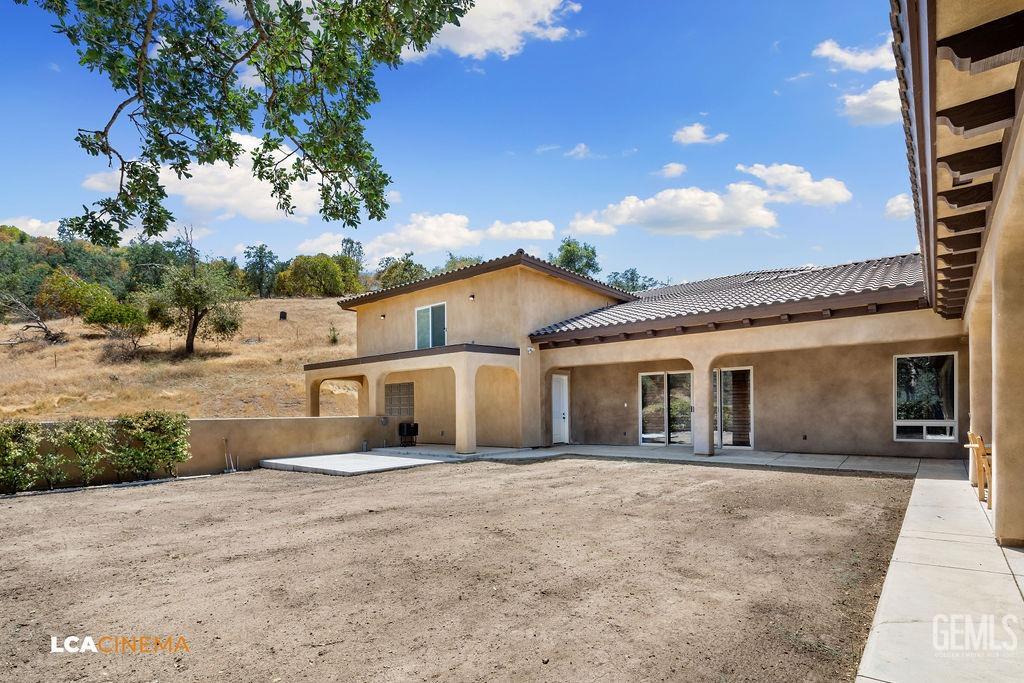 Undisclosed Address Keene, CA 93531 - Photo 35 of 46 a front view of a house with a garden