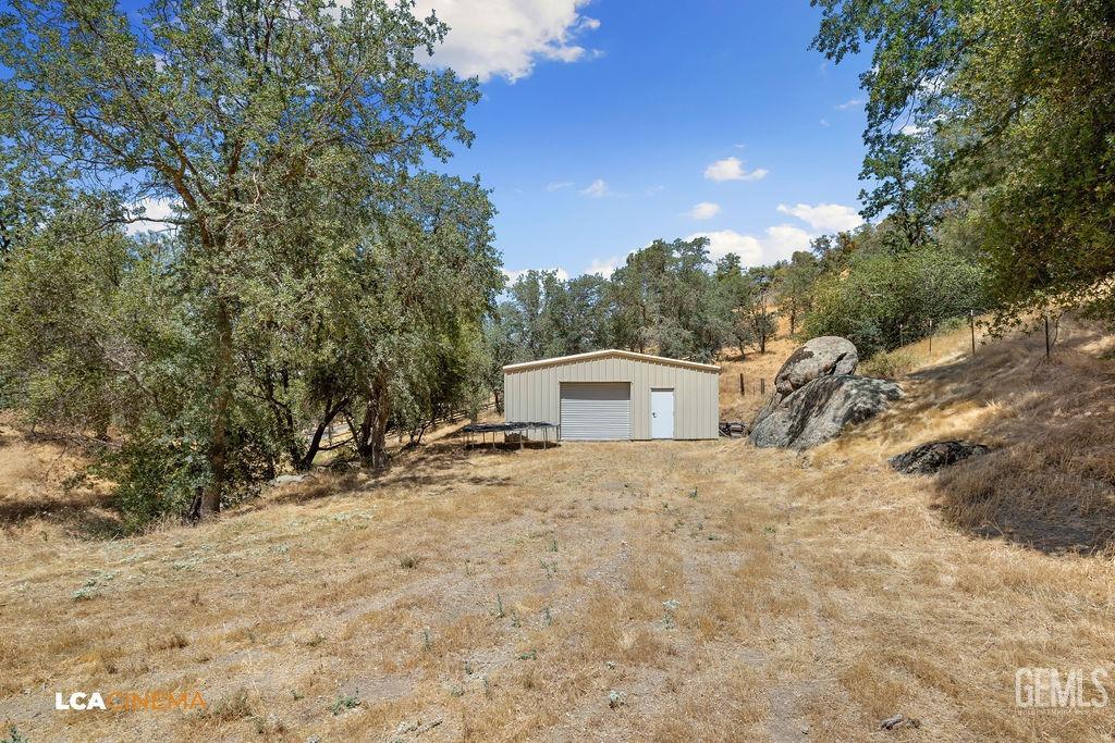 Undisclosed Address Keene, CA 93531 - Photo 37 of 46 a view of a house with a yard