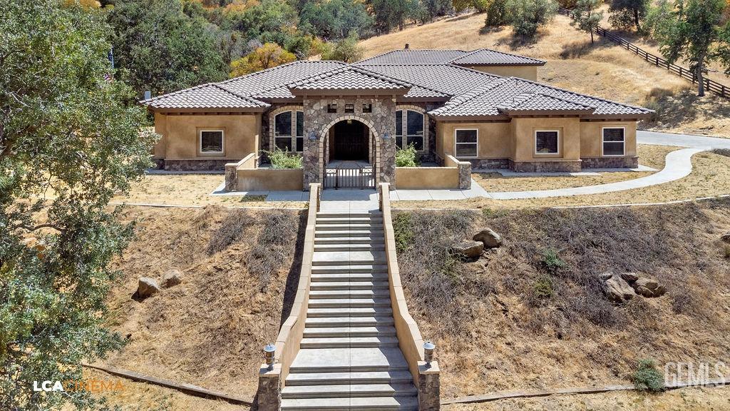 Undisclosed Address Keene, CA 93531 - Photo 4 of 46 a front view of a house with garden
