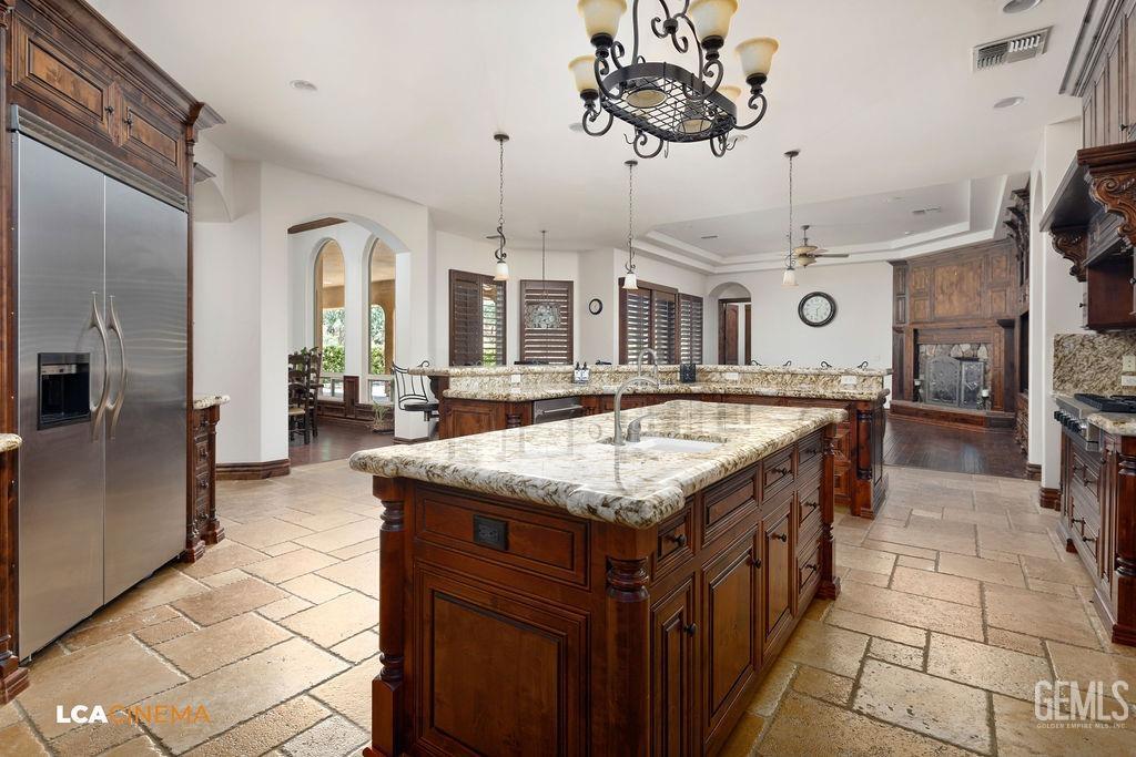 Undisclosed Address Keene, CA 93531 - Photo 10 of 46 a kitchen with cabinets and outdoor seating