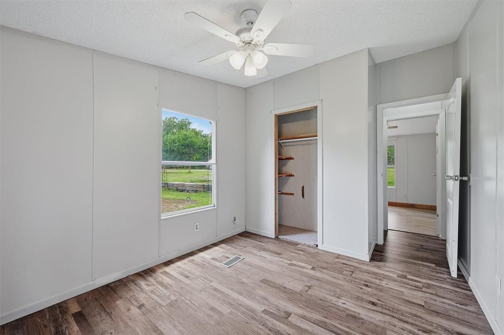 150 Gilbreath Road Sadler, TX 76264 - Photo 21 of 34 wooden floor in an empty room with a window