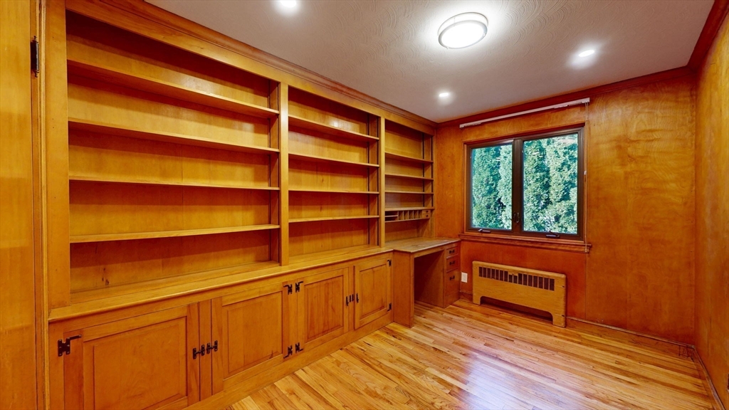 36 Lorna Road, Unit SF Newton, MA 02459 - Photo 16 of 25 a view of an empty room with a window and wooden floor