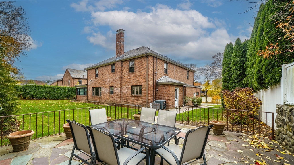 36 Lorna Road, Unit SF Newton, MA 02459 - Photo 9 of 25 a view of a house with a yard and furniture