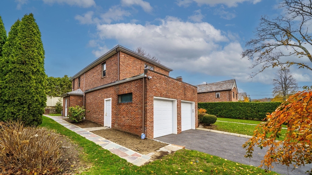36 Lorna Road, Unit SF Newton, MA 02459 - Photo 10 of 25 a view of a house with a yard