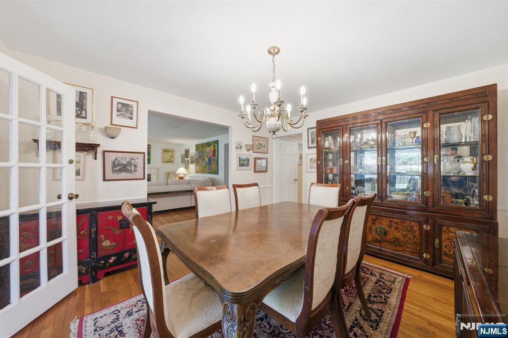 168 Engle Street Tenafly, NJ 07670 - Photo 11 of 50 a view of a dining room with furniture a chandelier and wooden floor