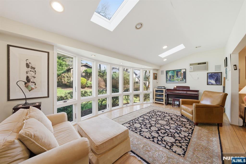 168 Engle Street Tenafly, NJ 07670 - Photo 14 of 50 a living room with furniture ceiling fan and rug