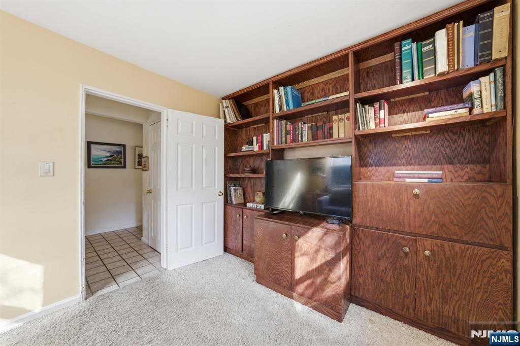 168 Engle Street Tenafly, NJ 07670 - Photo 22 of 50 a living room with furniture and a flat screen tv