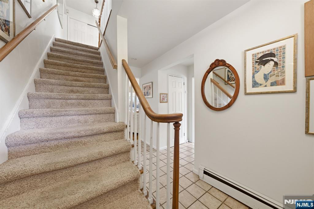 168 Engle Street Tenafly, NJ 07670 - Photo 24 of 50 a view of a hallway with wooden floor and white walls