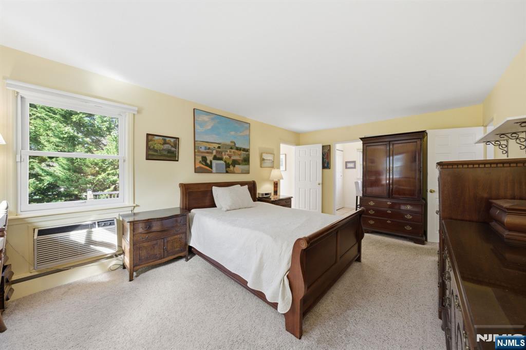 168 Engle Street Tenafly, NJ 07670 - Photo 26 of 50 a bed room with a bed and a large window