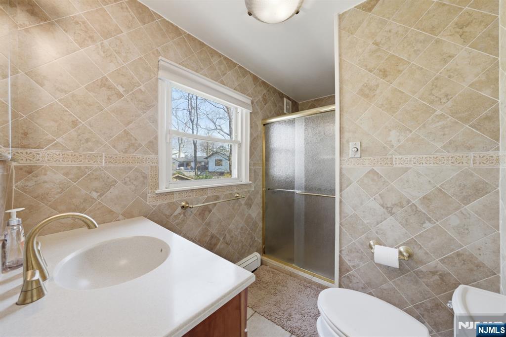 168 Engle Street Tenafly, NJ 07670 - Photo 30 of 50 a bathroom with a sink toilet and shower