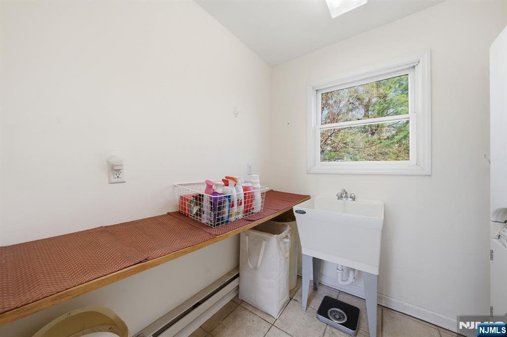 168 Engle Street Tenafly, NJ 07670 - Photo 32 of 50 a utility room with dryer and washer