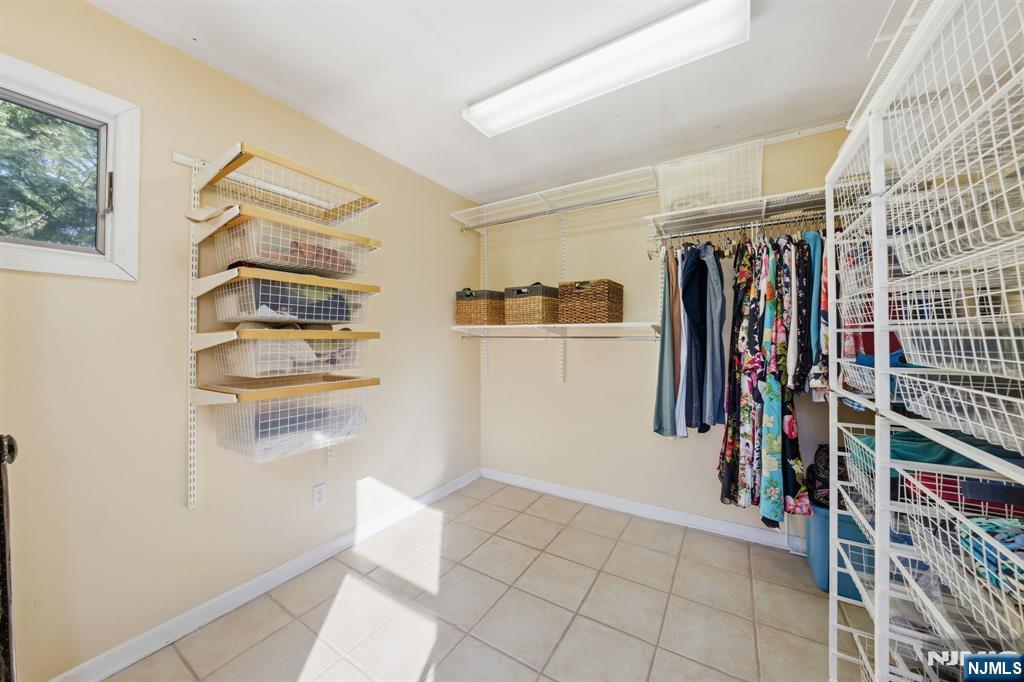 168 Engle Street Tenafly, NJ 07670 - Photo 33 of 50 a view of walk in closet with clothes and shoes