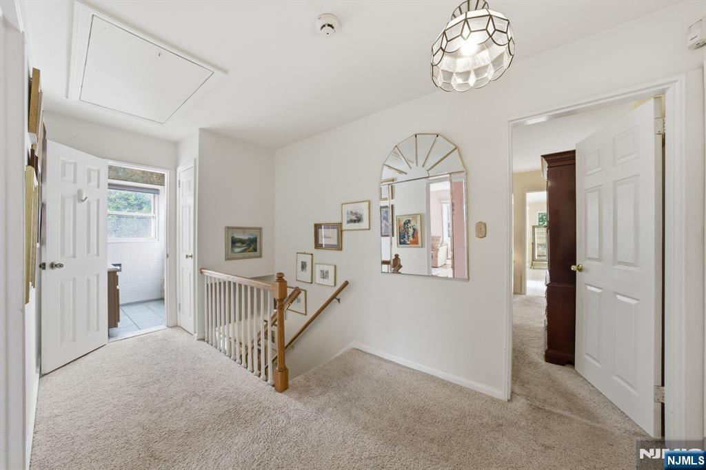 168 Engle Street Tenafly, NJ 07670 - Photo 39 of 50 an empty room with staircase and windows