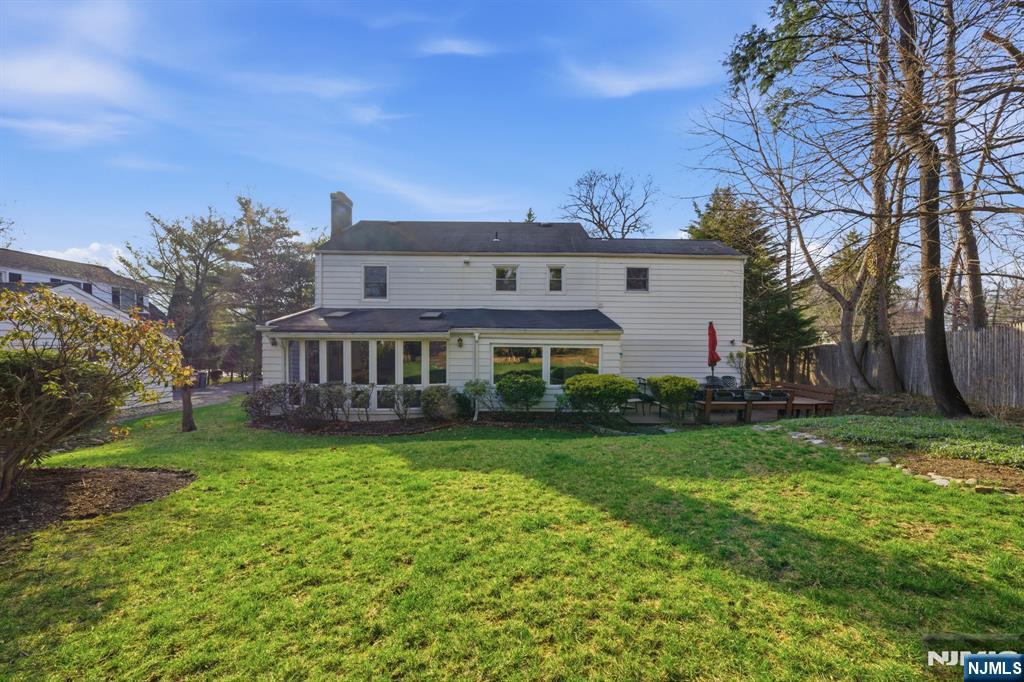 168 Engle Street Tenafly, NJ 07670 - Photo 44 of 50 a front view of a house with garden
