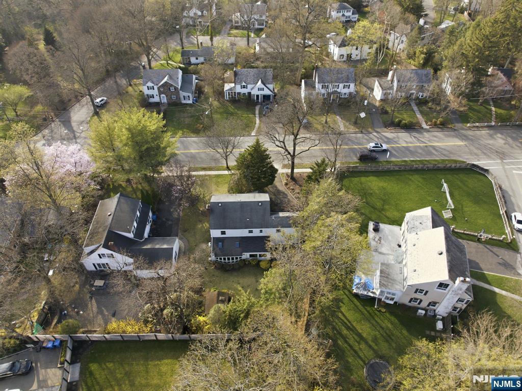 168 Engle Street Tenafly, NJ 07670 - Photo 49 of 50 a aerial view of a house with a garden and lake view