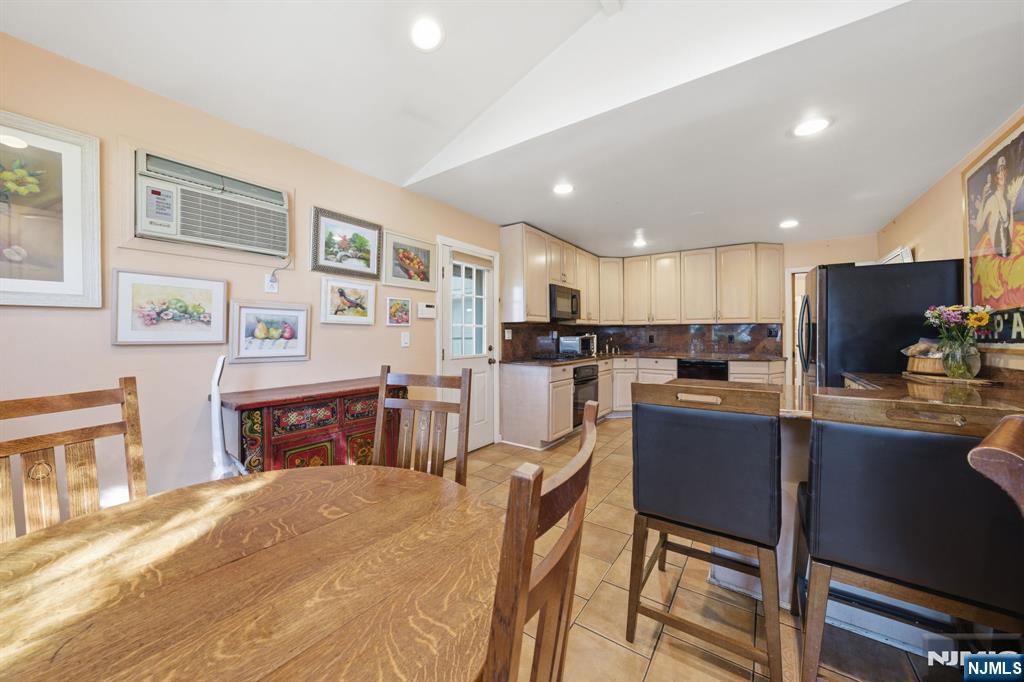168 Engle Street Tenafly, NJ 07670 - Photo 5 of 50 a kitchen with stainless steel appliances granite countertop a refrigerator stove microwave and sink