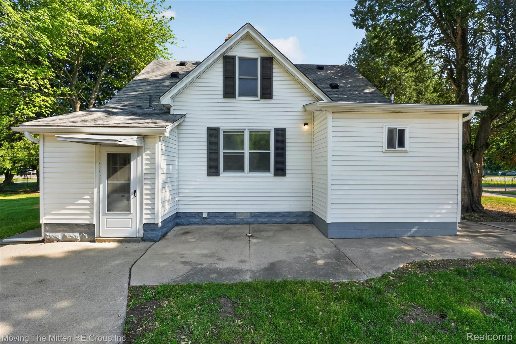 25505 Wick Road Taylor, MI 48180 - Photo 40 of 68 Back of property featuring a shingled roof and a yard