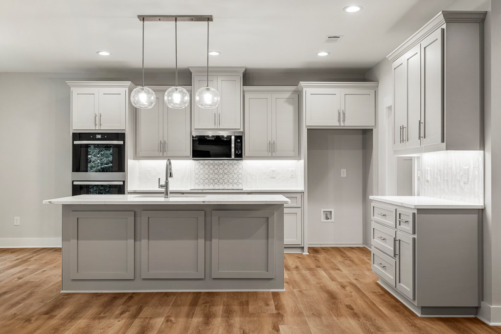 299 Ridgeway Drive Cataula, GA 31804 - Photo 14 of 52 a kitchen with stainless steel appliances granite countertop a sink a stove and a refrigerator