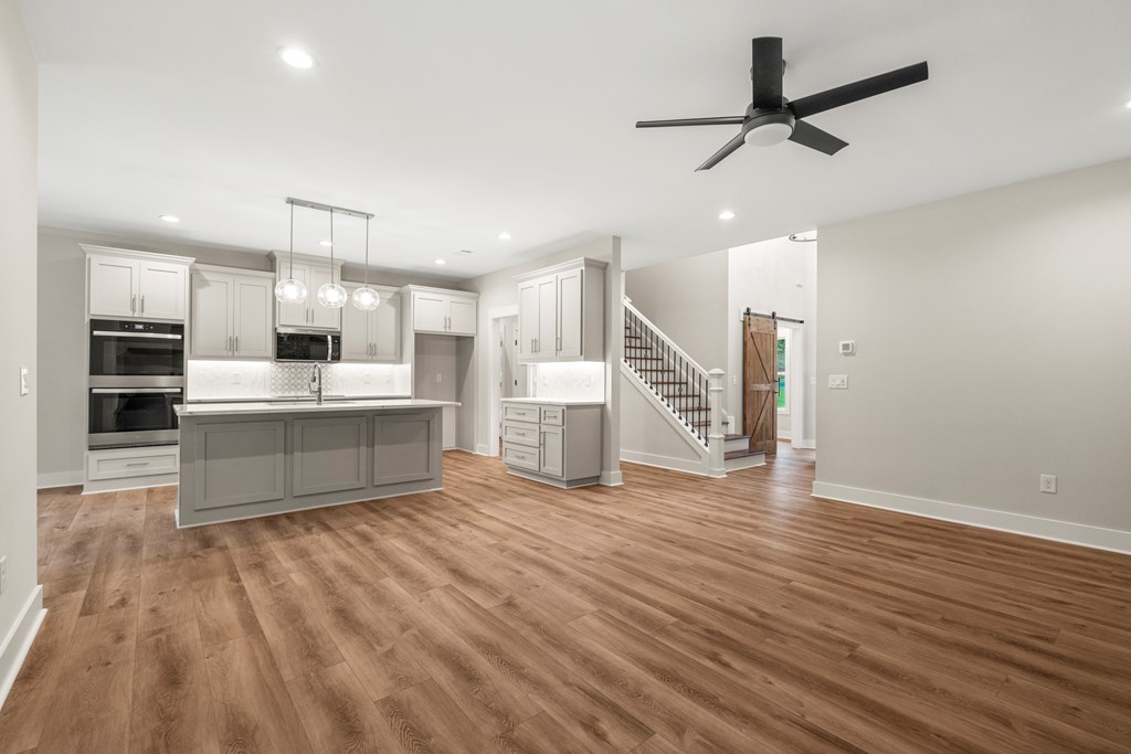 299 Ridgeway Drive Cataula, GA 31804 - Photo 15 of 52 a living room with stainless steel appliances kitchen island hardwood floor and a sink