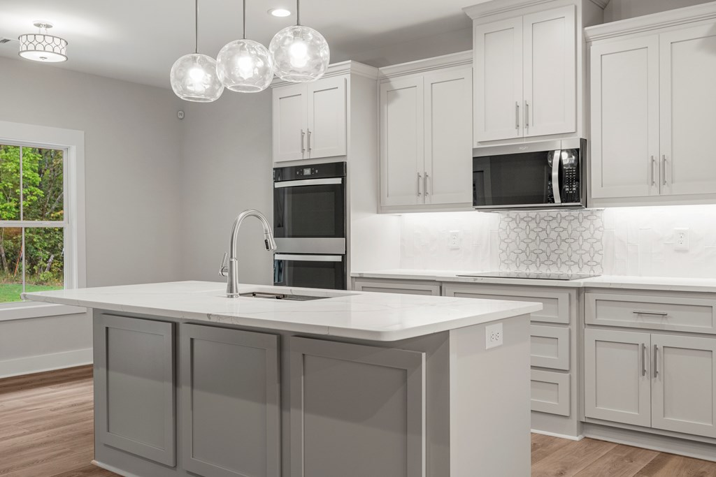 299 Ridgeway Drive Cataula, GA 31804 - Photo 16 of 52 a kitchen with cabinets appliances and a window