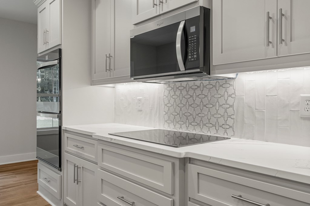 299 Ridgeway Drive Cataula, GA 31804 - Photo 18 of 52 a close view of a sink and a microwave in a kitchen