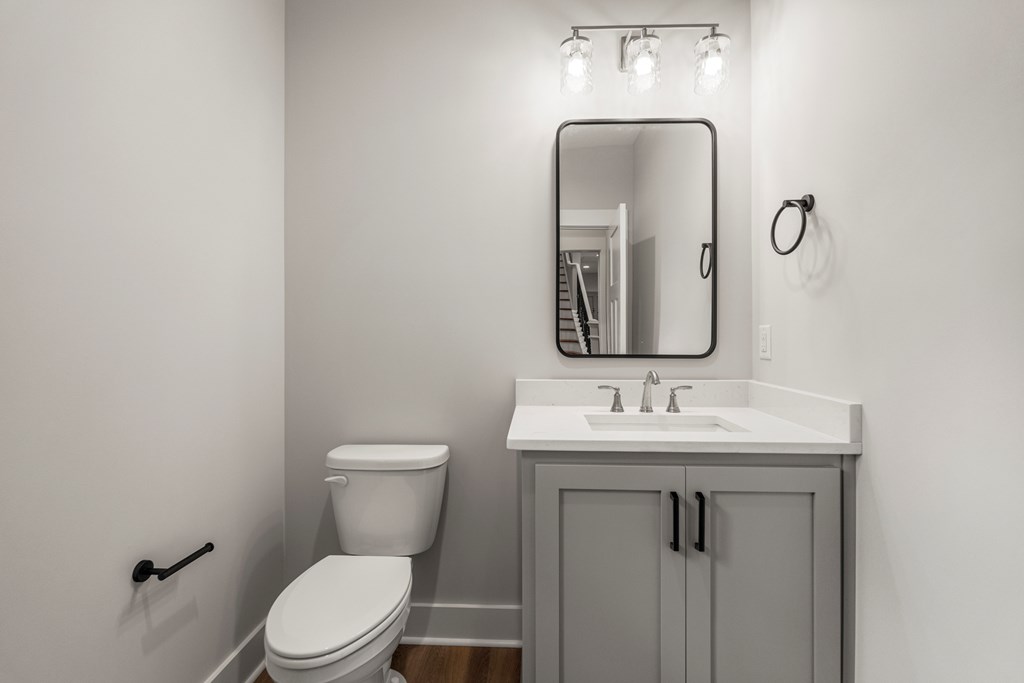 299 Ridgeway Drive Cataula, GA 31804 - Photo 20 of 52 a bathroom with a toilet sink and mirror