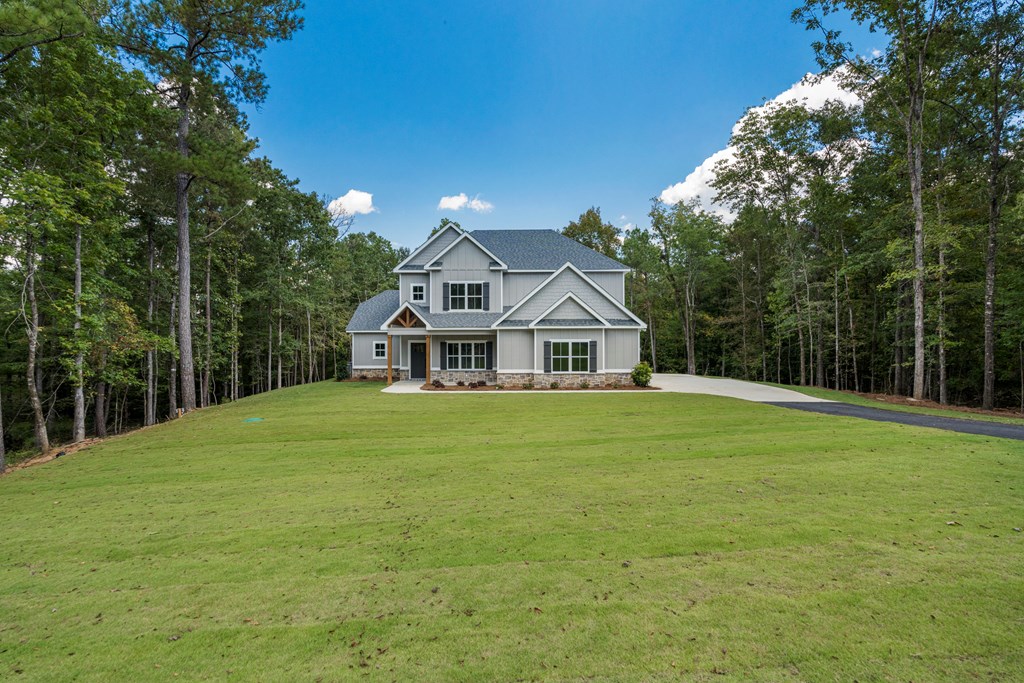 299 Ridgeway Drive Cataula, GA 31804 - Photo 2 of 52 a front view of a house with a garden