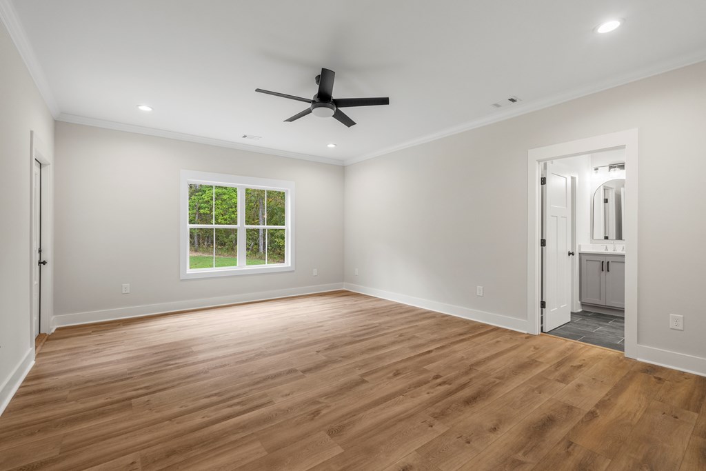 299 Ridgeway Drive Cataula, GA 31804 - Photo 24 of 52 an empty room with wooden floor and windows