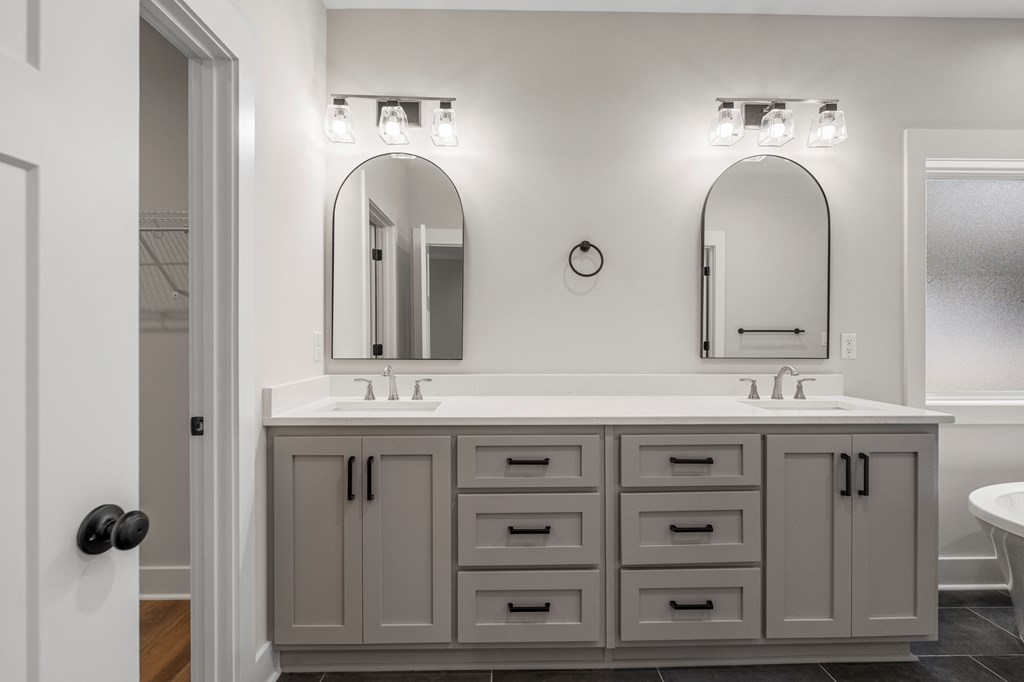299 Ridgeway Drive Cataula, GA 31804 - Photo 26 of 52 a bathroom with a granite countertop sink a mirror and a