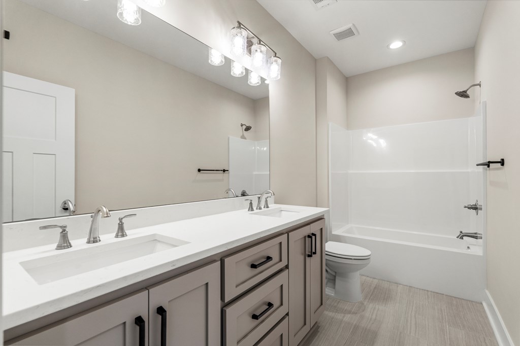 299 Ridgeway Drive Cataula, GA 31804 - Photo 35 of 52 a bathroom with a sink a toilet and shower
