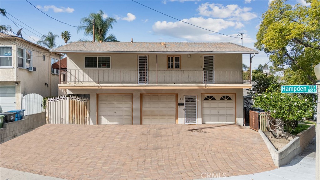 101 Hampden Terrace Alhambra, CA 91801 - Photo 1 of 46 a view of a white house with large windows and potted plants