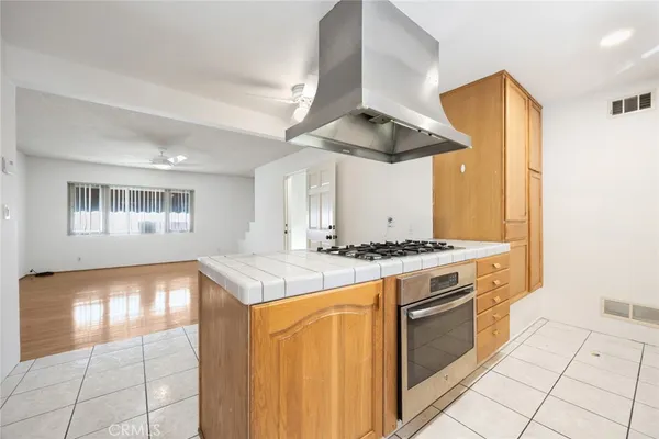 a kitchen with a stove and a refrigerator