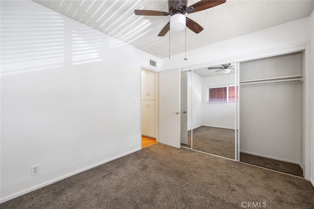 101 Hampden Terrace Alhambra, CA 91801 - Photo 18 of 46 en empty room with chandelier fan and a ceiling fan