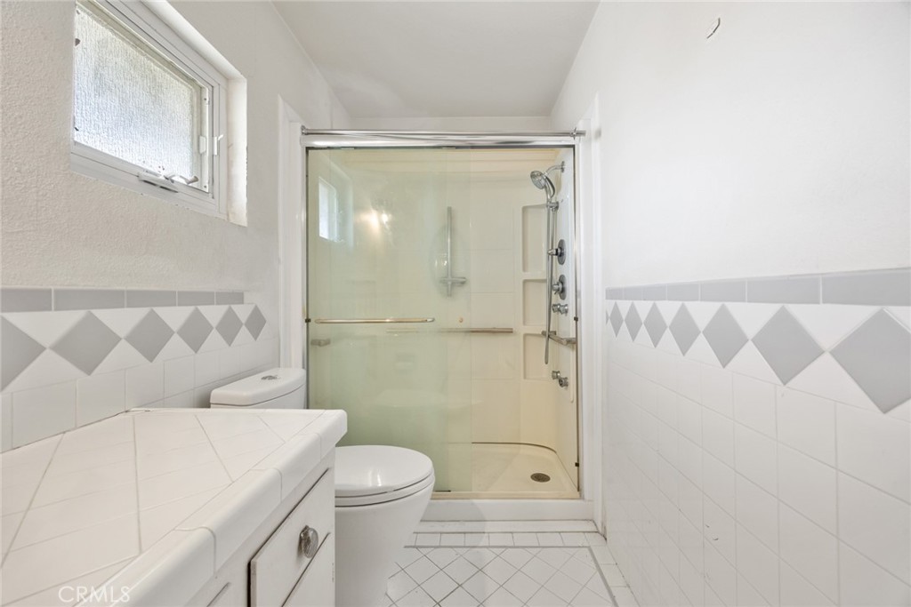 101 Hampden Terrace Alhambra, CA 91801 - Photo 30 of 46 a bathroom with a toilet a sink and shower