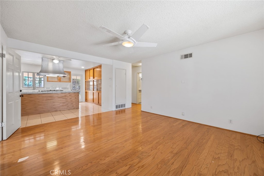 101 Hampden Terrace Alhambra, CA 91801 - Photo 3 of 46 an empty room with wooden floor and windows