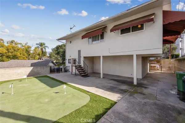 a view of a house with swimming pool