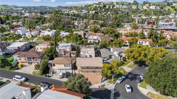 an aerial view of residential houses with outdoor space